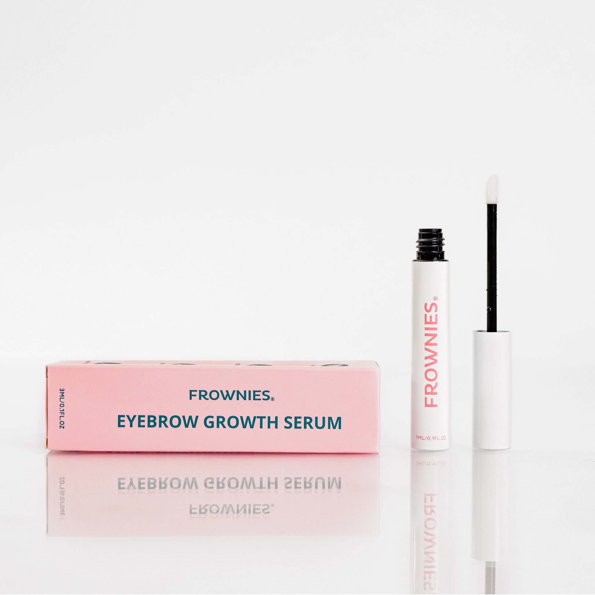 Frownies Eyebrow Growth Serum shown outside its box, featuring its pink packaging.