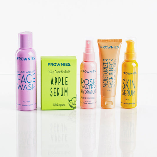 Group of Frownies products - face wash, apple serum, rose water hydrator spray, moisturizer for face and neck, and skin serum 