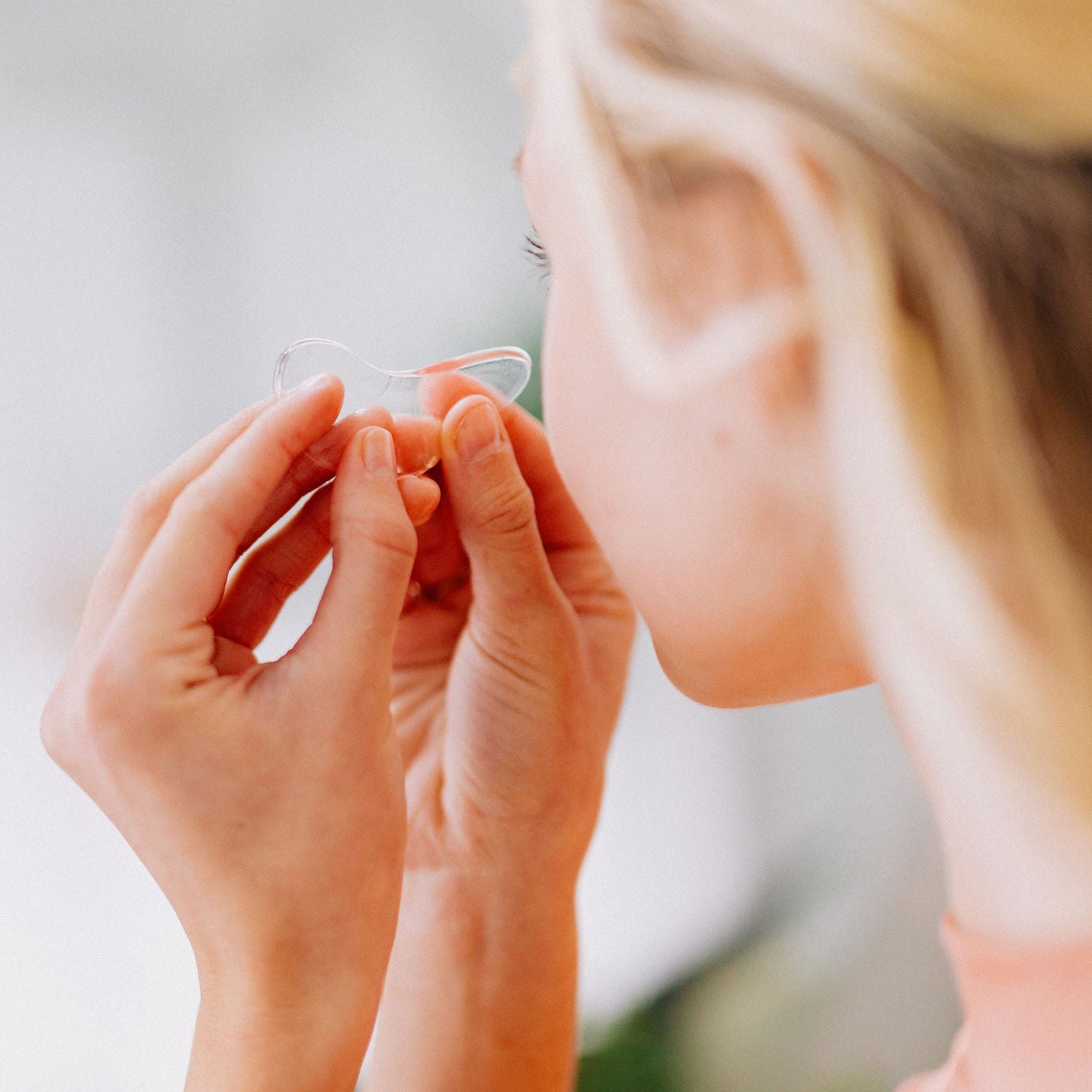 Frownies cactus collagen under eye gel shown being applied to the under eye area by a woman