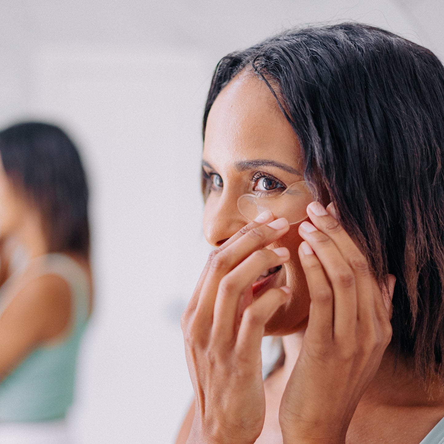 Frownies cactus collagen under eye gel shown being applied to the under eye area by a woman