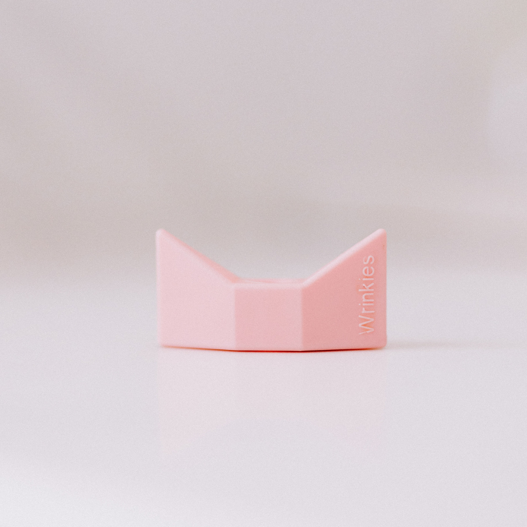 close up of pink bow-shaped Wrinkies anti-pursing straw tip 