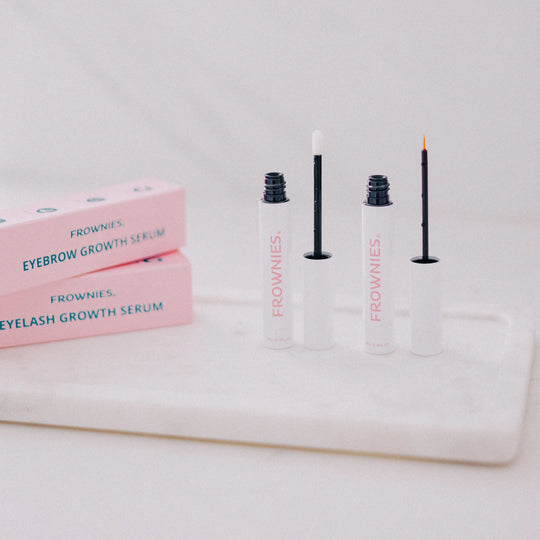 Frownies lash and brow serum displayed on a clean background with packaging present.